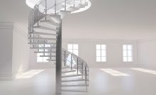 Eine Spindeltreppe, die in einen leeren, weißen Raum führt