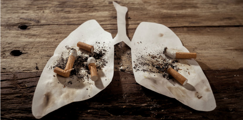Lungenkrebs: Lungenschablone mit ausgedrückten Zigaretten darauf